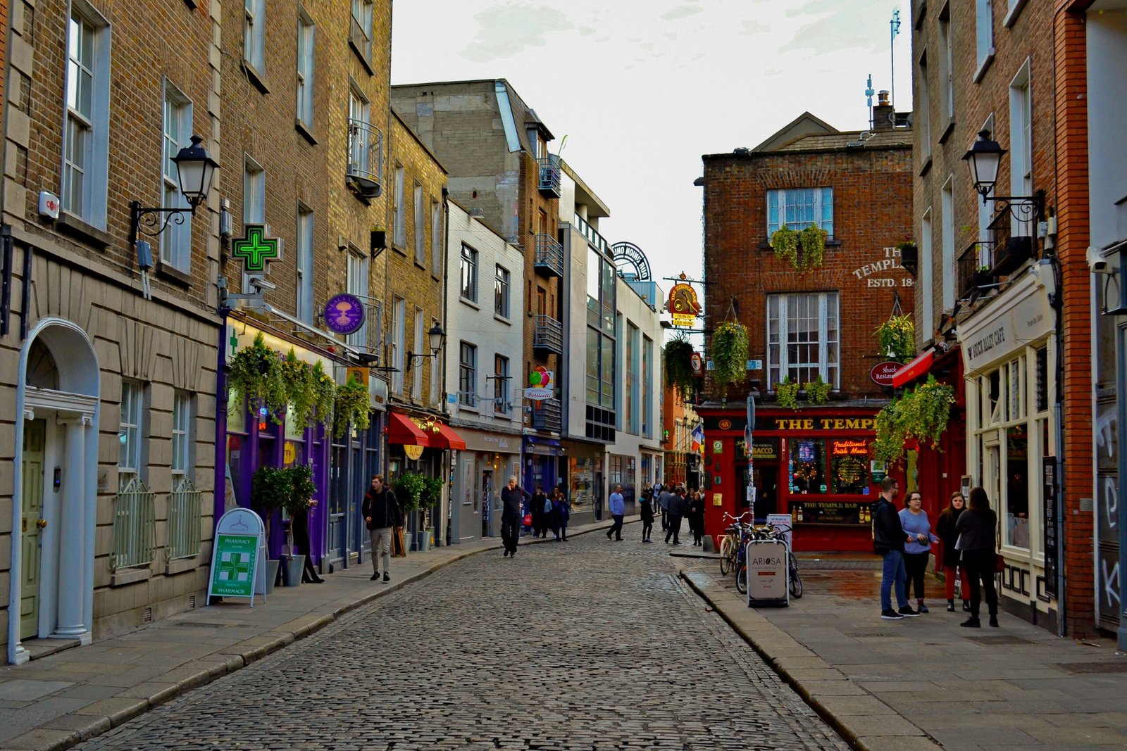Explore Dublin's vibrant Temple Bar district, a popular tourist hub with charming architecture and cobblestone streets.